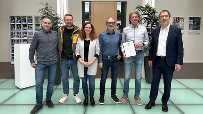 Geschäftsführung der Zimmer Group mit Mitarbeiter Klaus Seifried